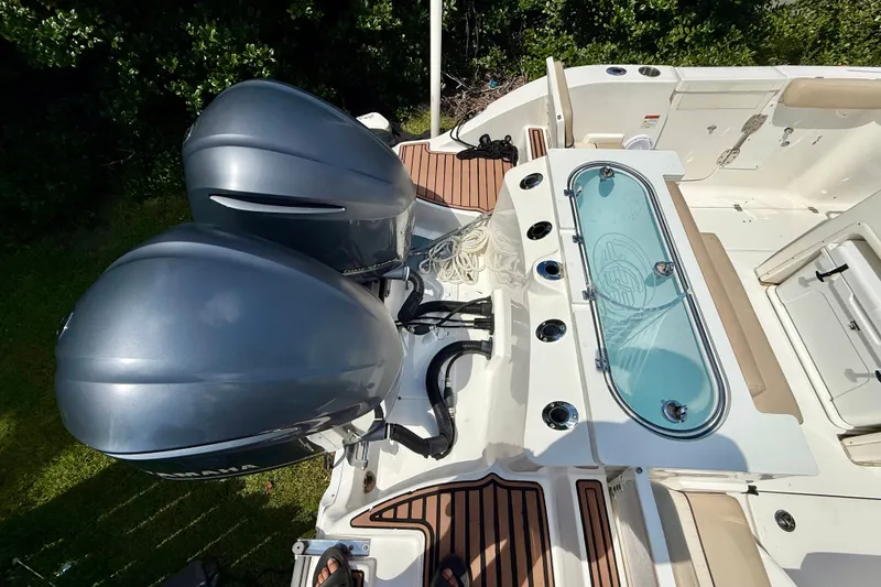 Slide: The Image of 2017 Sea Fox 288 Commander boat with dual engines and fishing rod holders. - 10
