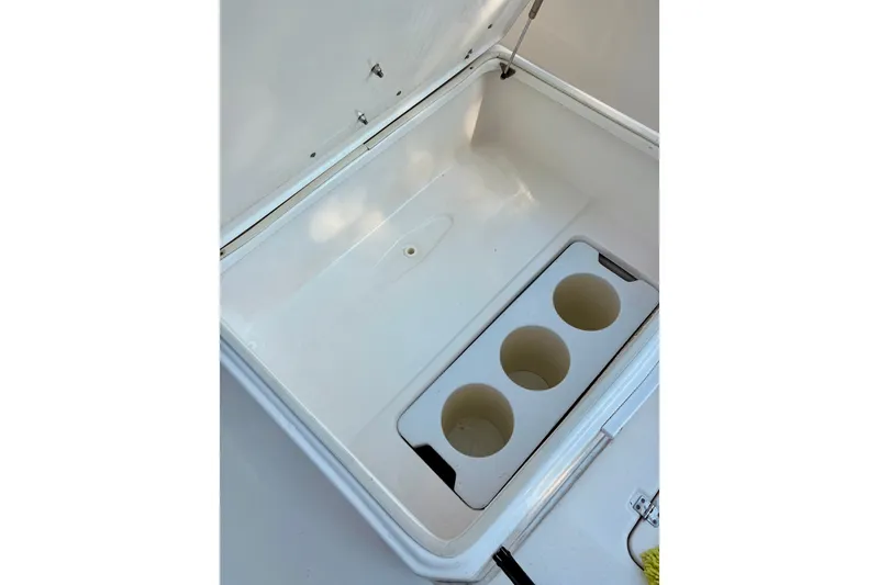 Slide: The Image of Open storage compartment with cup holders on a 2017 Sea Fox 288 Commander boat. - 32