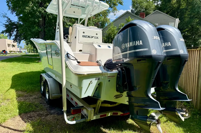 Slide: The Image of 2017 Sea Fox 288 Commander boat with dual Yamaha 300 engines on a trailer. - 2
