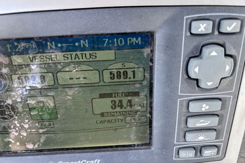 Slide: The Image of Close-up of a SmartCraft display showing vessel status and fuel level on a 2006 Boston Whaler Outrage 270. - 17