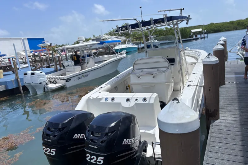Slide: The Image of 2006 Boston Whaler Outrage 270 docked, featuring dual Mercury Verado 225 engines. - 14