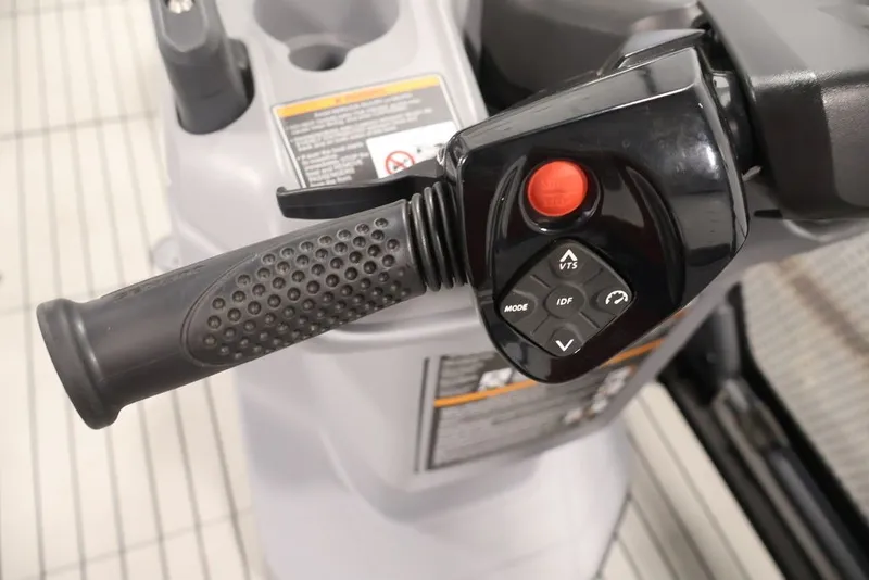 Slide: The Image of Handlebar controls of 2022 Sea-Doo Switch Sport 21, featuring buttons and grip. - 25