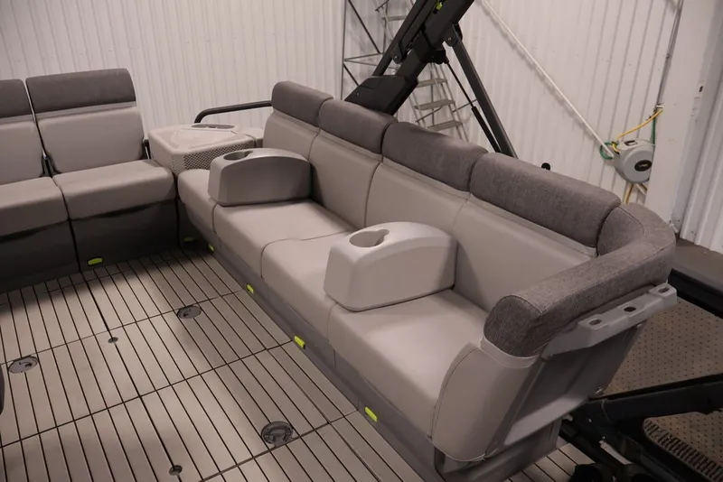 Slide: The Image of 2022 Sea-Doo Switch Sport 21 interior with gray seating and cup holders. - 31