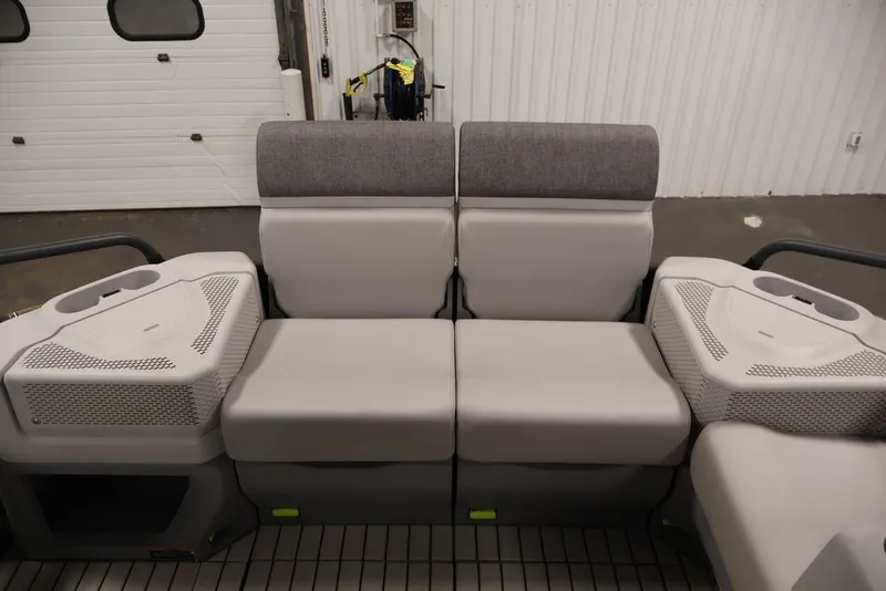 Slide: The Image of 2022 Sea-Doo Switch Sport 21 interior seating with gray upholstery in a garage setting. - 29