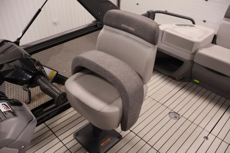 Slide: The Image of 2022 Sea-Doo Switch Sport 21 interior with comfortable seating and steering controls. - 32