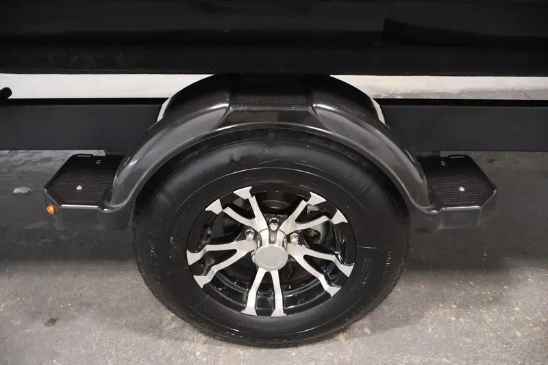 Slide: The Image of Trailer wheel of 2022 Sea-Doo Switch Sport 21, featuring sleek black and silver design. - 40