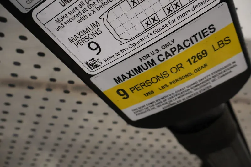 Slide: The Image of 2022 Sea-Doo Switch Sport 21 capacity label, maximum 9 persons or 1269 lbs. - 23