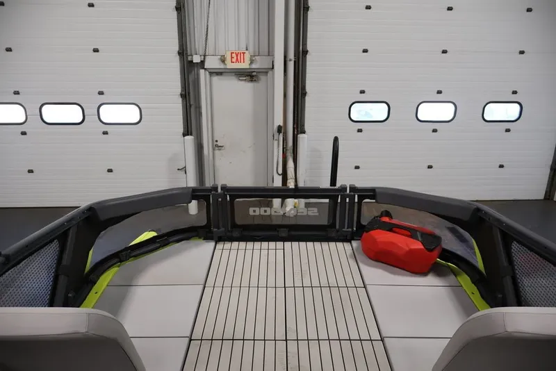 Slide: The Image of 2022 Sea-Doo Switch Sport 21 interior with red fuel container in garage setting. - 17