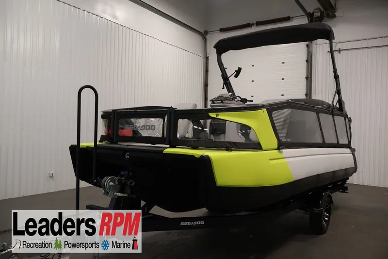 The Image of 2022 Sea-Doo Switch Sport 21 in showroom, featuring vibrant yellow and black design. - 1