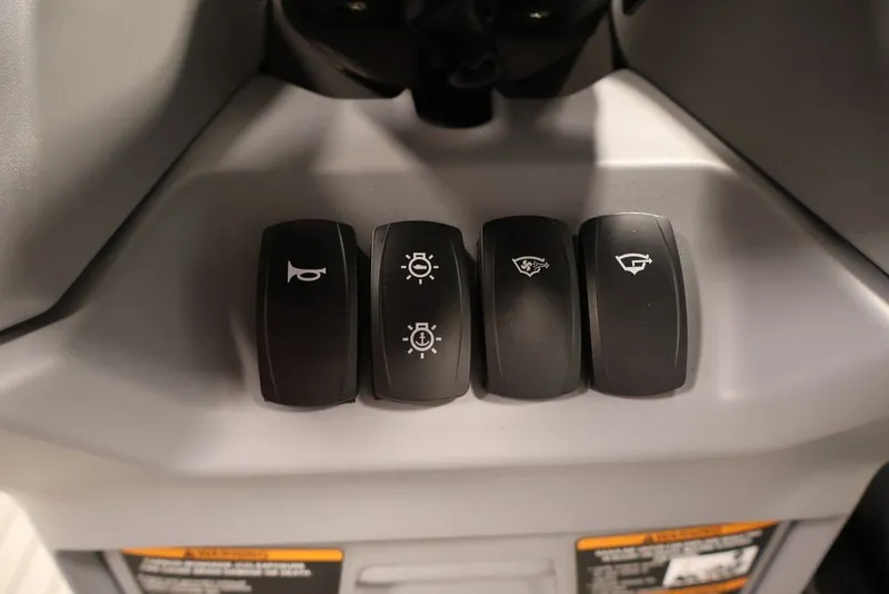 Slide: The Image of Control panel of 2022 Sea-Doo Switch Sport 21 with various function buttons. - 22