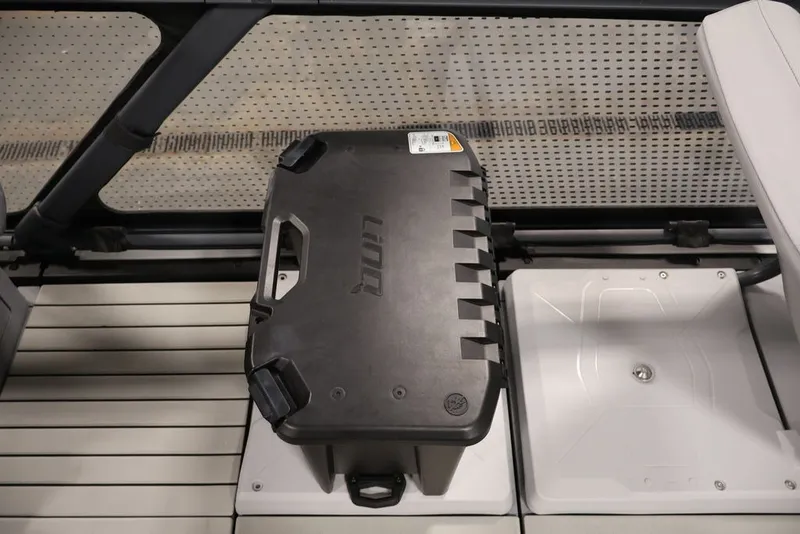Slide: The Image of 2022 Sea-Doo Switch Sport 21 interior with storage compartment and seating. - 14