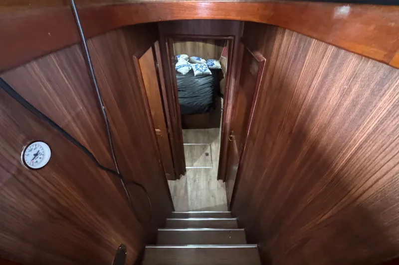 Slide: The Image of Interior view of 1989 Ocean Yachts 48 Motor Yacht with wooden stairs and cabin. - 87