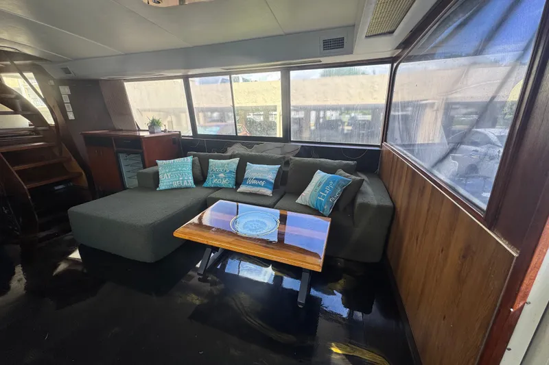 Slide: The Image of Interior of 1989 Ocean Yachts 48 Motor Yacht with cozy seating and decorative pillows. - 58