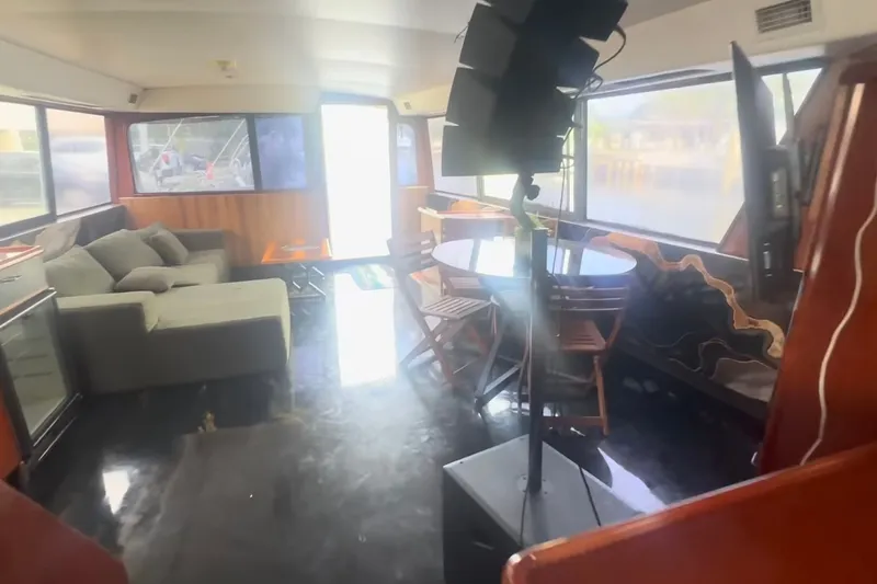 Slide: The Image of Interior of 1989 Ocean Yachts 48 Motor Yacht with modern furnishings and large windows. - 19