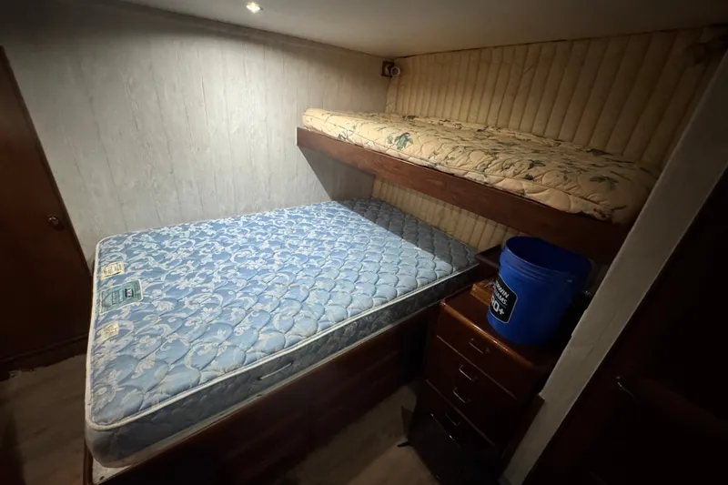 Slide: The Image of Interior cabin of 1989 Ocean Yachts 48 Motor Yacht with bunk beds and storage. - 94