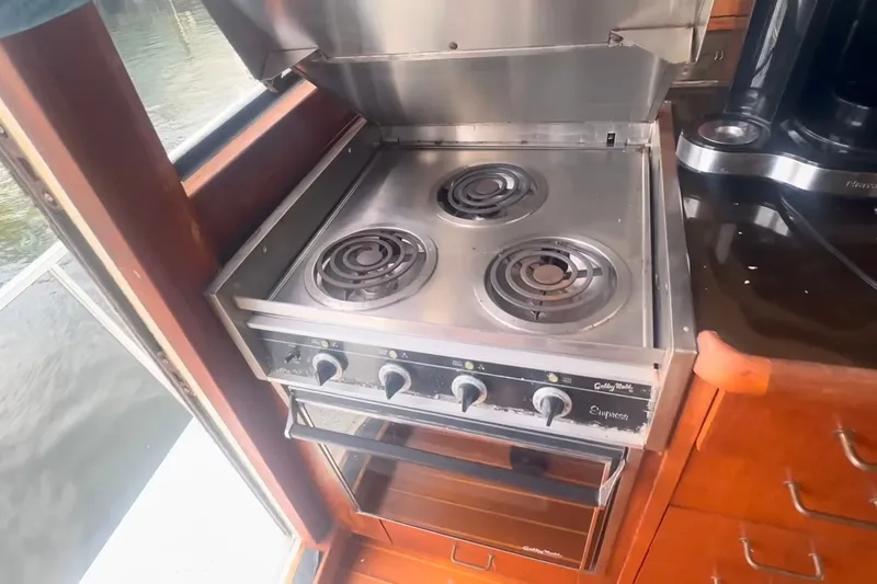 Slide: The Image of Stainless steel stove in 1989 Ocean Yachts 48 Motor Yacht kitchen area. - 13