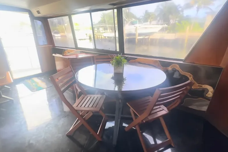 Slide: The Image of Interior of 1989 Ocean Yachts 48 Motor Yacht with round table and chairs. - 20
