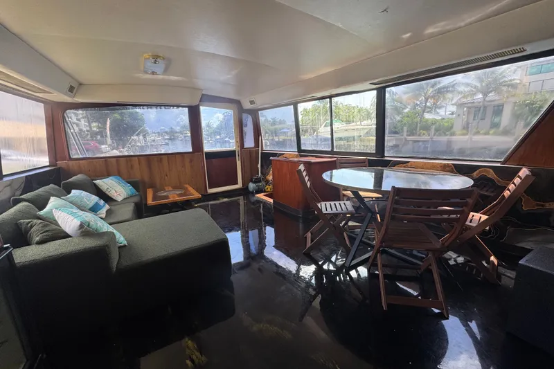 Slide: The Image of Interior of 1989 Ocean Yachts 48 Motor Yacht with seating and dining area. - 59