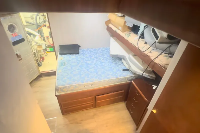 Slide: The Image of Interior cabin of 1989 Ocean Yachts 48 Motor Yacht with bed and storage. - 49