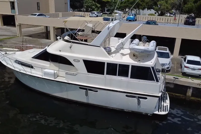 Slide: The Image of 1989 Ocean Yachts 48 Motor Yacht docked in marina, side view. - 125