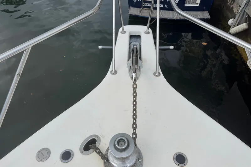 Slide: The Image of Bow of 1989 Ocean Yachts 48 Motor Yacht with anchor chain and railing. - 114