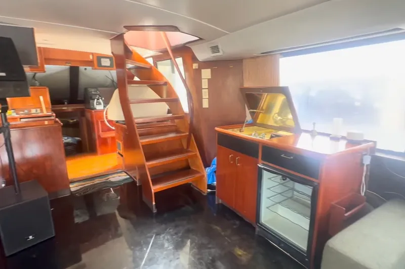 Slide: The Image of Interior of 1989 Ocean Yachts 48 Motor Yacht with wooden stairs and kitchenette. - 22