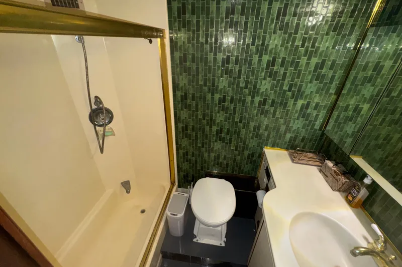Slide: The Image of Bathroom interior of 1989 Ocean Yachts 48 Motor Yacht with green tile walls. - 119