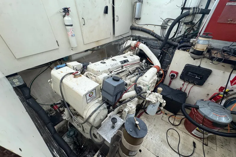 Slide: The Image of Engine room of a 1989 Ocean Yachts 48 Motor Yacht with visible machinery and equipment. - 97
