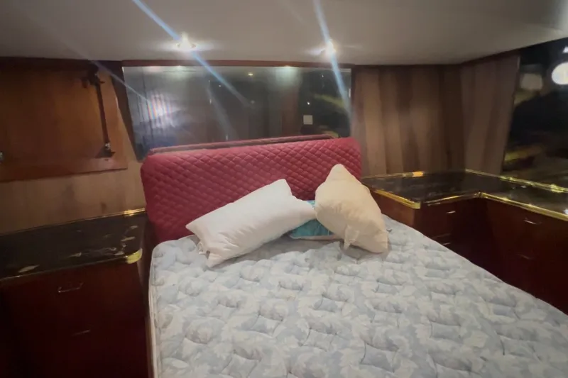 Slide: The Image of Interior cabin of 1989 Ocean Yachts 48 Motor Yacht with bed and pillows. - 28
