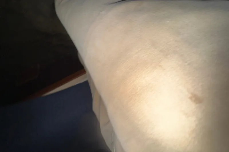 Slide: The Image of Cushioned seating on 1989 Ocean Yachts 48 Motor Yacht, featuring light fabric upholstery. - 118