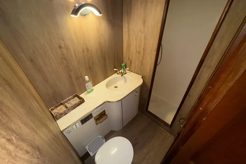 Slide: The Image of Bathroom interior of 1989 Ocean Yachts 48 Motor Yacht with shower and sink. - 92