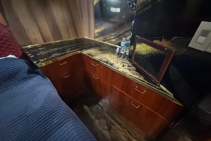 Slide: The Image of Interior of 1989 Ocean Yachts 48 Motor Yacht with wood cabinetry and decorative countertop. - 116