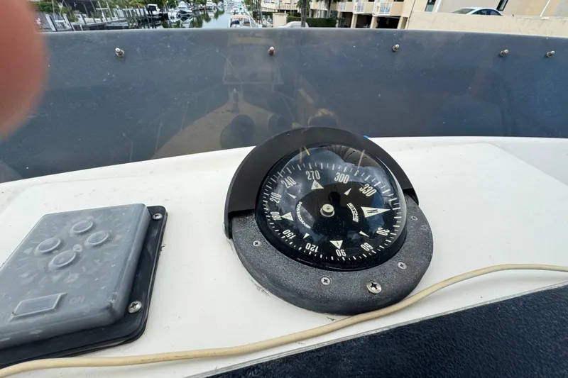 Slide: The Image of Compass and control panel on 1989 Ocean Yachts 48 Motor Yacht. - 104