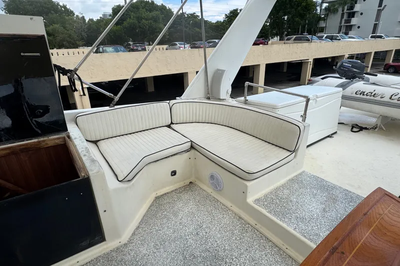 Slide: The Image of 1989 Ocean Yachts 48 Motor Yacht with white cushioned seating on deck. - 108