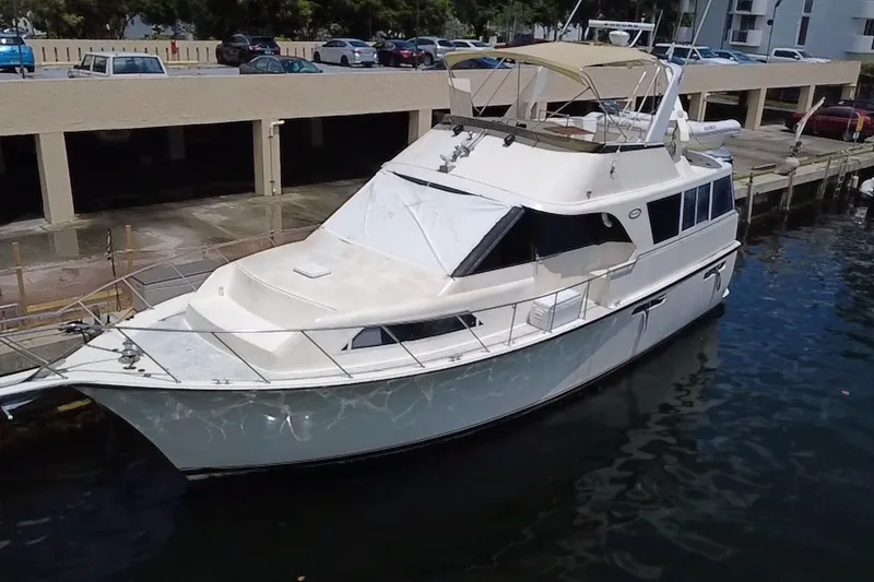 Slide: The Image of 1989 Ocean Yachts 48 Motor Yacht docked in a marina, side view. - 127
