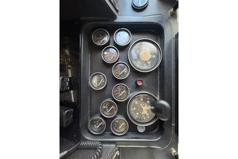 Slide: The Image of Control panel of a 1989 Ocean Yachts 48 Motor Yacht with various gauges and dials. - 75