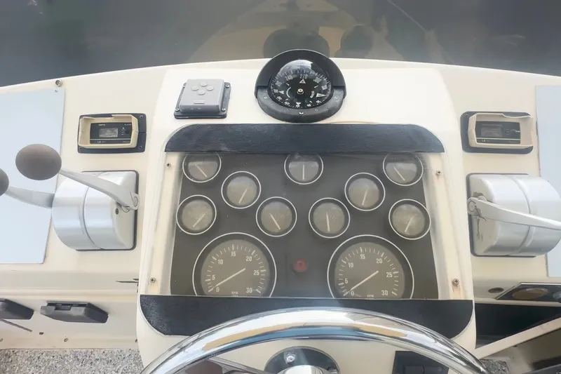 Slide: The Image of Dashboard of a 1989 Ocean Yachts 48 Motor Yacht with gauges and controls. - 37