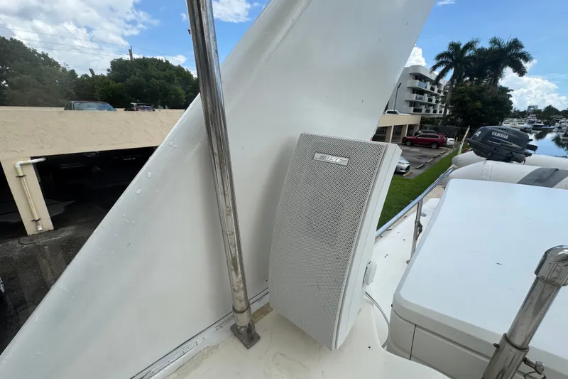 Slide: The Image of Outdoor speaker on 1989 Ocean Yachts 48 Motor Yacht deck, with scenic marina view. - 112