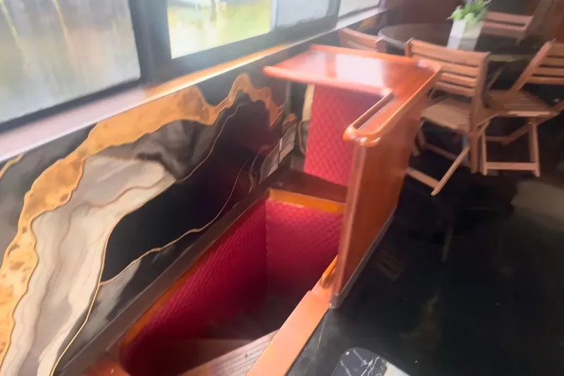 Slide: The Image of Interior of 1989 Ocean Yachts 48 Motor Yacht with wooden stairs and dining area. - 26