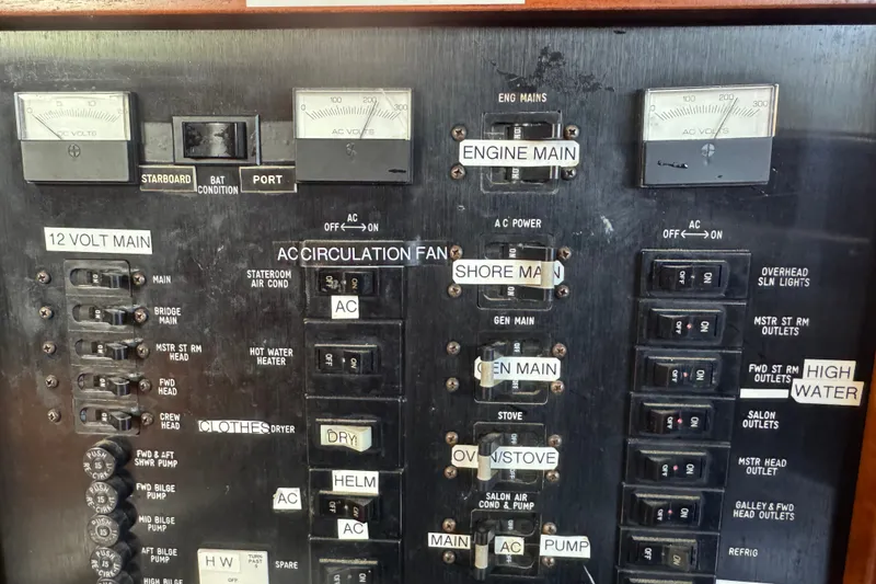Slide: The Image of Electrical control panel of a 1989 Ocean Yachts 48 Motor Yacht, featuring various switches and gauges. - 65