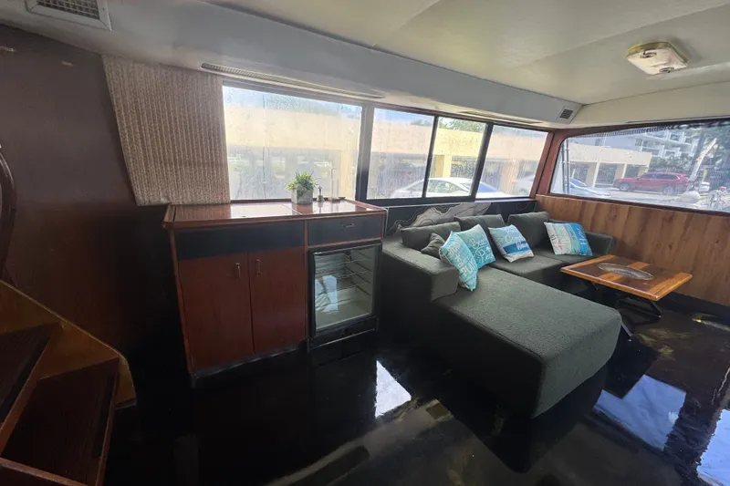 Slide: The Image of Interior of 1989 Ocean Yachts 48 Motor Yacht with sofa, table, and cabinet. - 60