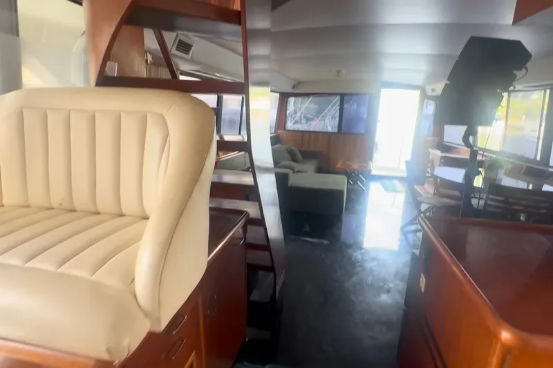 Slide: The Image of Interior of 1989 Ocean Yachts 48 Motor Yacht with seating and wooden accents. - 18