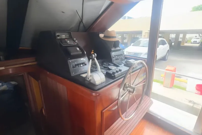 Slide: The Image of Interior helm of 1989 Ocean Yachts 48 Motor Yacht with steering wheel and controls. - 15