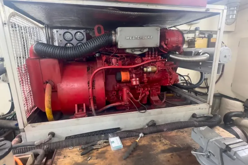 Slide: The Image of Engine room of 1989 Ocean Yachts 48 Motor Yacht with Westerbeke generator. - 54