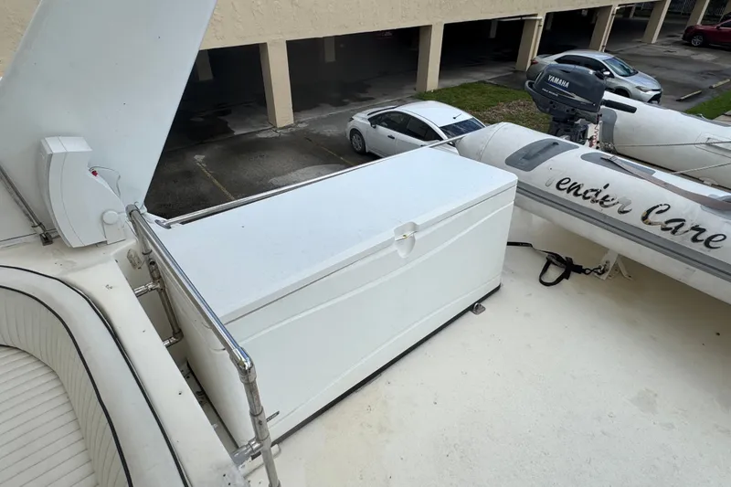 Slide: The Image of 1989 Ocean Yachts 48 Motor Yacht deck with storage box and inflatable boat. - 109