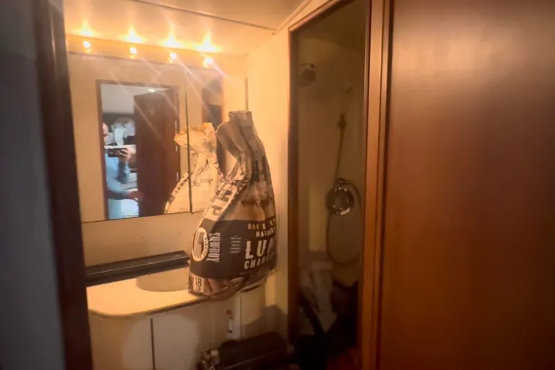 Slide: The Image of Bathroom interior of 1989 Ocean Yachts 48 Motor Yacht with mirror and shower. - 52