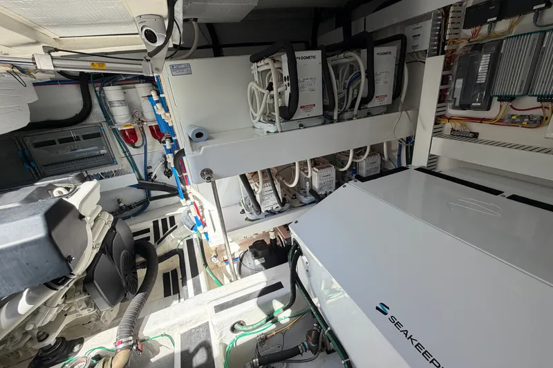 Slide: The Image of Engine room of 2020 Sabre 58 Salon Express with Seakeeper stabilizer and Dometic systems. - 49