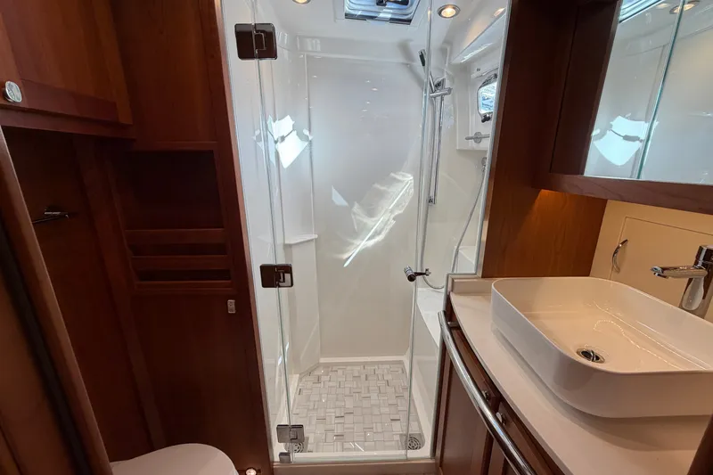 Slide: The Image of Luxurious bathroom in 2020 Sabre 58 Salon Express yacht with modern shower and sink. - 33