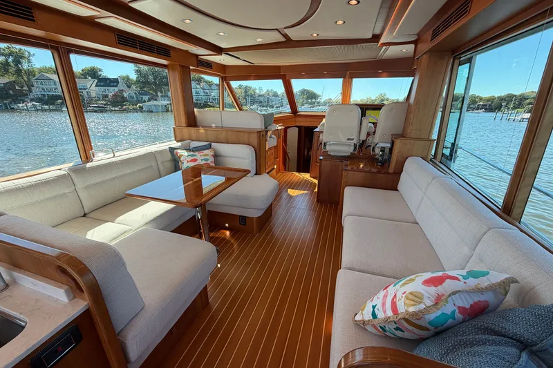 Slide: The Image of Luxurious interior of 2020 Sabre 58 Salon Express yacht with elegant seating and scenic water views. - 4