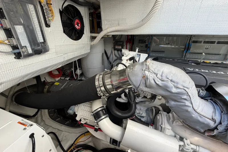 Slide: The Image of Engine room of 2020 Sabre 58 Salon Express, showcasing mechanical components and wiring. - 53